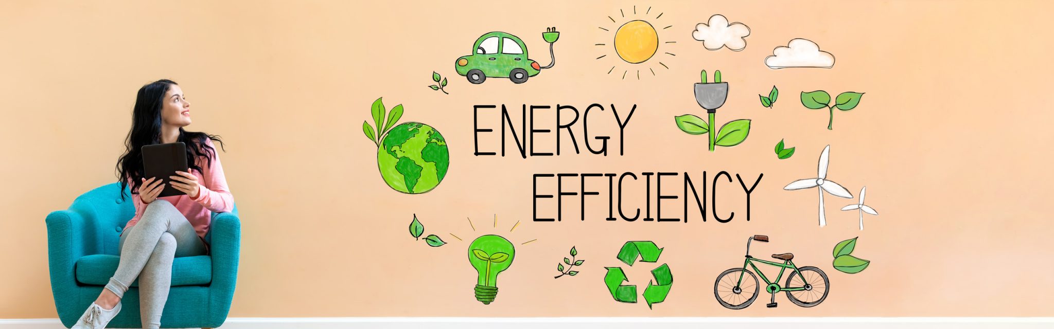 Woman sitting on a teal chair looks at wall art showing eco-friendly icons and the words Energy Efficiency.
