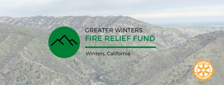 A hazy mountain landscape with text: Greater Winters Fire Relief Fund, Winters, California and a Rotary International logo.